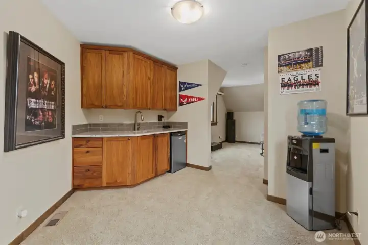 Enertainment Nook Featuring Mini Fridge, Sink and Walnut Cabinets