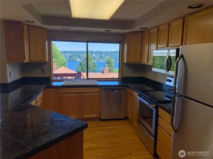 Kitchen with plenty of cabinetry and views
