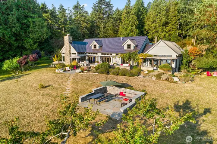 Multiple entertaining patios and sitting areas are found all over this stunning waterfront property.