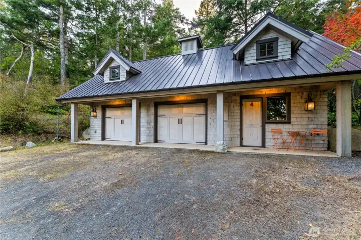895 SF two car garage with studio guest suite to the right side.