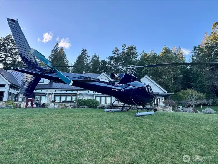Helicopter can land in the front yard in multiple locations. There is also a private airport 5 minutes away in Roche Harbor. This is a real photo, not AI.