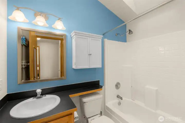 Tall ceilings and a skylight fill the space with natural light — you’ll rarely need to flip a switch.