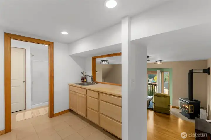 SEPARATE UNIT: Kitchen overlooks the living and dining room. Bathroom just off the kitchen.