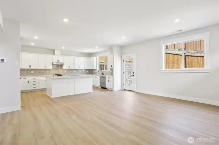 View from family into kitchen with access to fully landscaped rear yard.