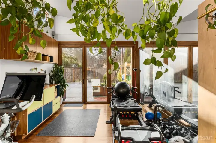 Currently set up as a home gym - this space comes furnished with hardwood & a separate mini-split system for custom climate control