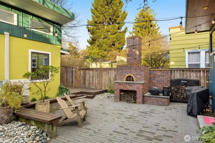 Brick wood fire pizza oven makes for an engaging way to entertain