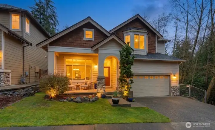 Capture the essence of Pacific Northwest living in this stunning home with a welcoming front porch, and mature trees.