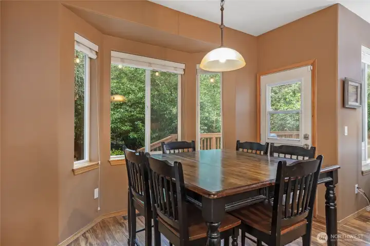 Enjoy your morning coffee in the bright breakfast nook, surrounded by windows that bring the outdoors in. Direct access to the back deck makes indoor-outdoor dining a breeze.