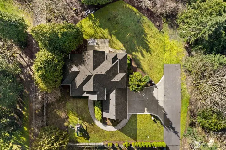 Surrounded by mature landscaping with direct access to the Soos Creek Trail.