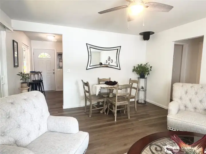 Dining area and living room - showcasing the open concept and natural light.