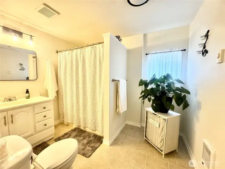 Gorgeous bathroom with tub and shower. The space features a luxurious design, complete with both a relaxing soaking tub and a refreshing, invigorating shower, offering versatility and comfort for any homeowner.