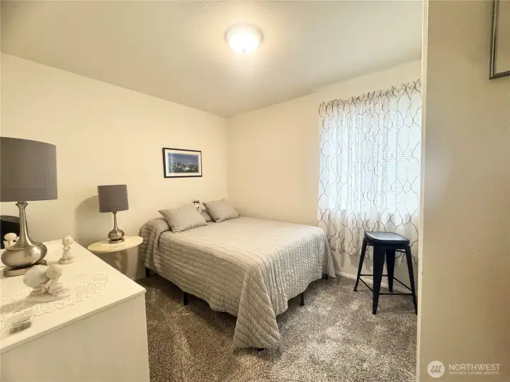 Second bedroom is light and bright! It features ample natural light, creating a welcoming and airy atmosphere. The space is well-suited for relaxation or use as a comfortable guest room.
