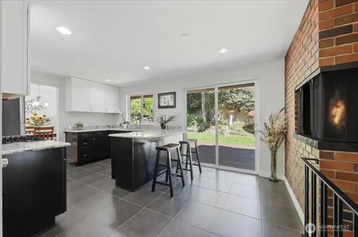Heated ceramic tiled flooring, wood burning fireplace by the kitchen eating bar is a great place to start the day.