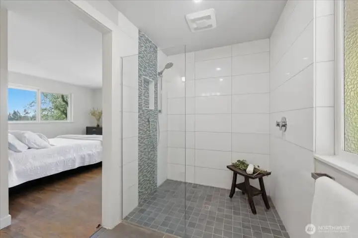 Renovated primary bath with walk-in shower.