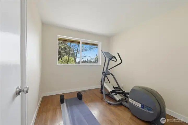 Guest bedroom 1 is set up for an in-home work out space.