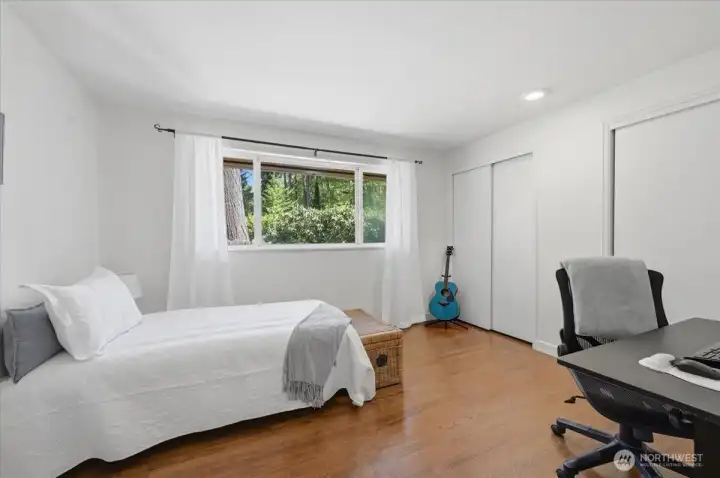 Guest bedroom 3 with ample closet space and enough room for an office.
