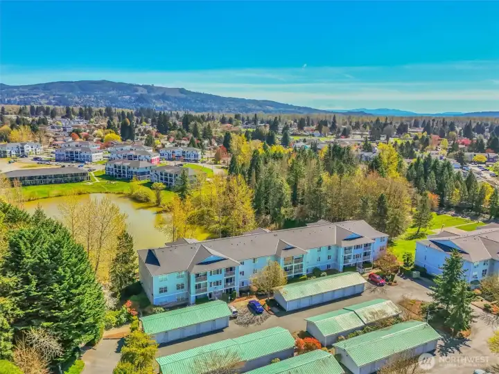 Well kept Canoe Club Condos with big pond, nearby trails, and a large fenced grass and play area in the complex.