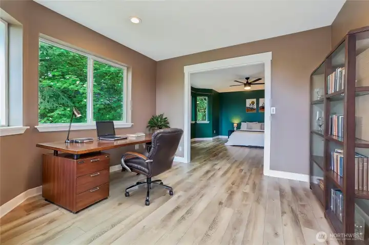 Primary bedroom with and additional office room Virtually staged
