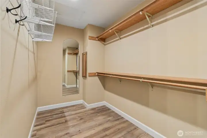 Primary walk-in closet with laundry chute
