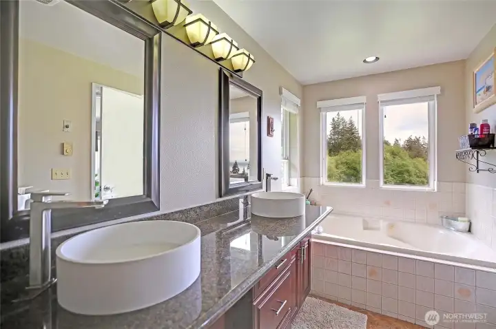 Relax and unwind in the jetted tub after a long day.