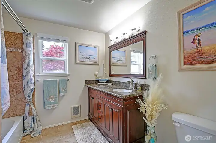 Spacious full bathroom designed for guests and everyday convenience.