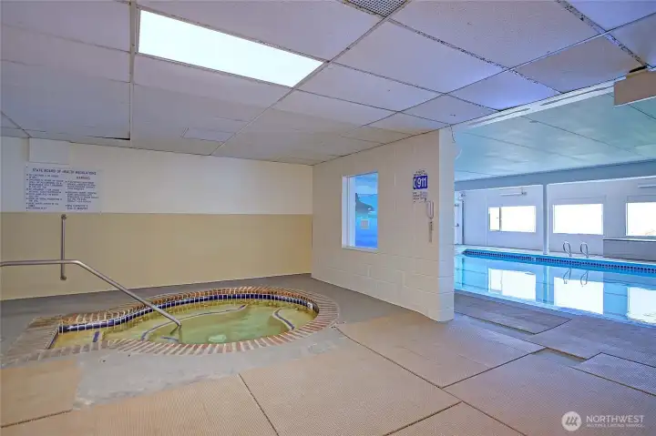 Community clubhouse featuring an indoor pool, hot tub, and gathering space for residents to enjoy.