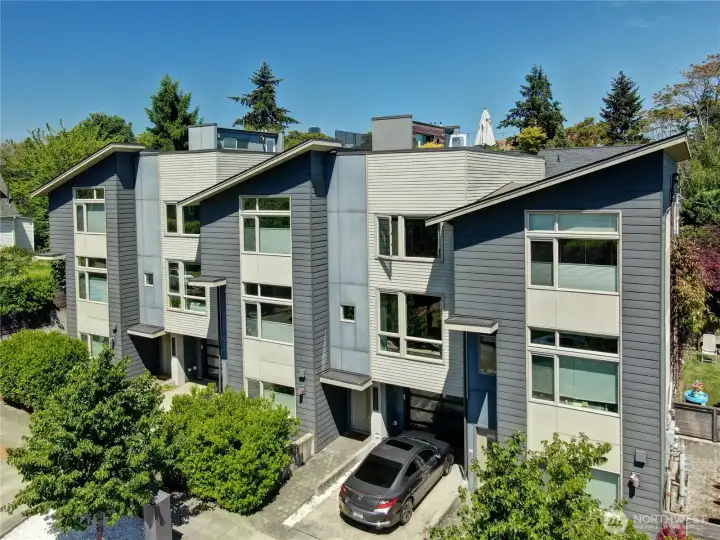 Part of a 5 unit Built Green project, this is one of only 2 homes with a driveway & a garage. The home is the 2nd from the left.