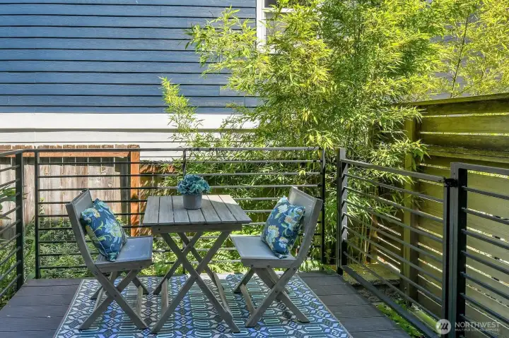 Private deck off dining area for easy access to outdoor dining & room for your own personal gardening touches.