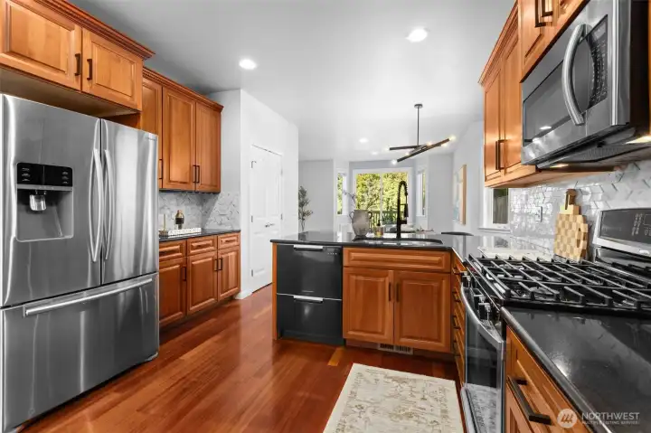 Kitchen provides entertainment ease with flow to sunilt back deck