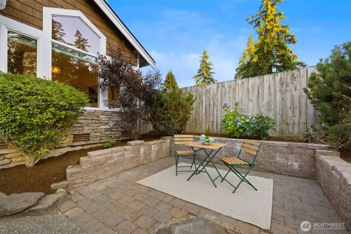 Private outdoor seating area in front for low maintainence yard