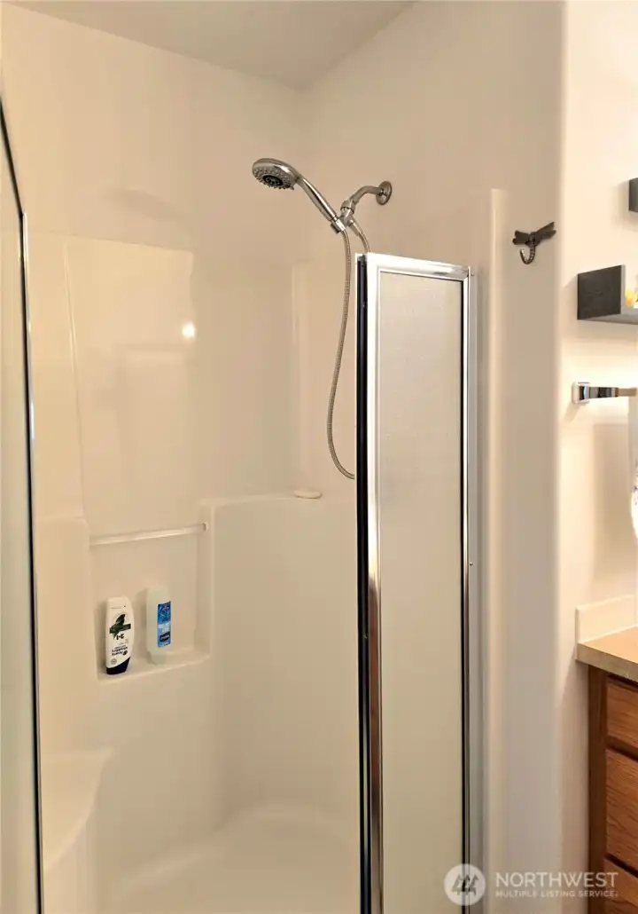 Walk-in shower with seat.