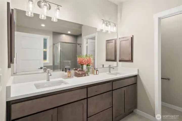 Primary En-suite w/ Ceramic Tile Floors and slab Quartz Counters. Primary En-suite w/ Ceramic Tile Floors and slab Quartz Counters.