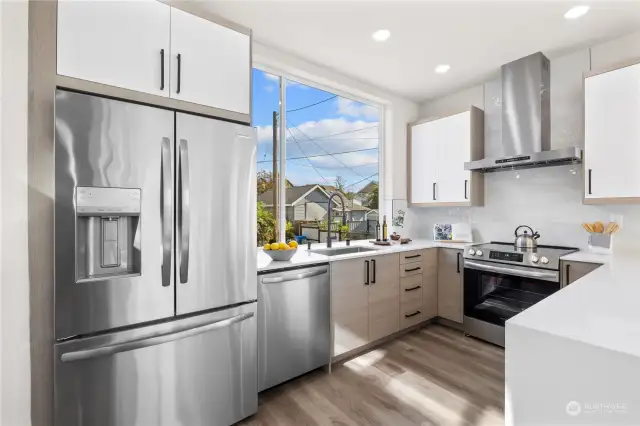 A bright, airy kitchen with a spacious layout, stainless steel appliances, and elegant finishes.