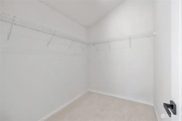 Spacious walk-in closet with plenty of storage and shelving space for organization.