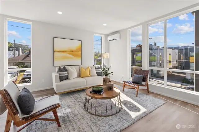 Enjoy abundant sunshine and a serene atmosphere in this bright, inviting living room.