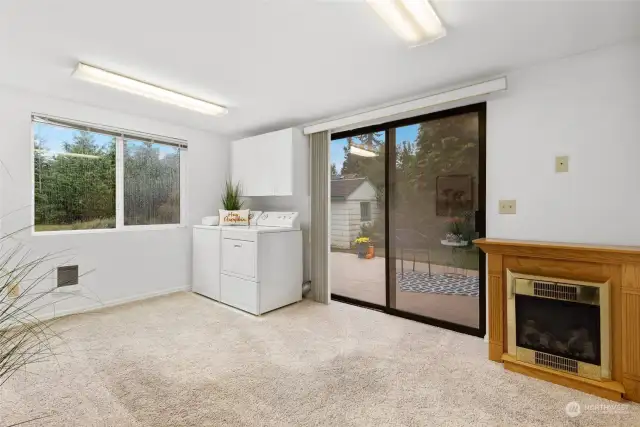 A slider opening out to the deck and serene, fully fenced backyard.