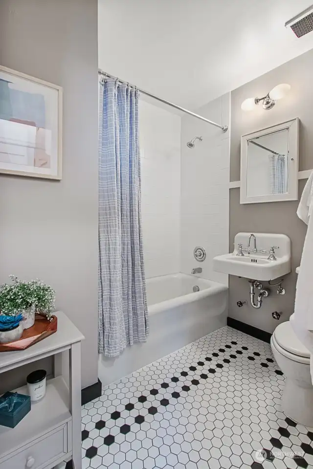 Updated bathroom yet leaving the original tub & sink for a vintage feel. The cast iron tub stays warm longer for when it’s time to relax!