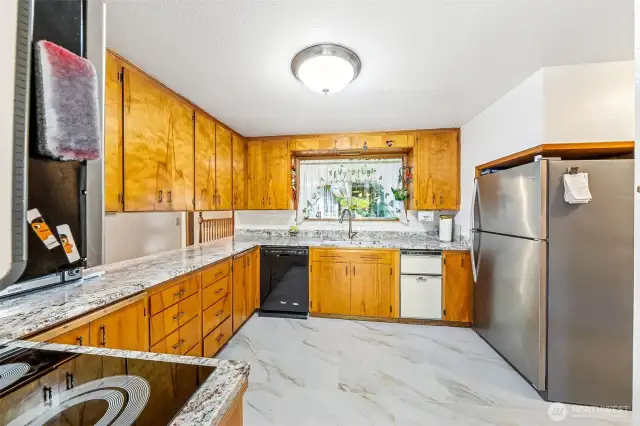 New granite counters, new ceramic flooring, newer stainless-steel appliances. Double ovens.