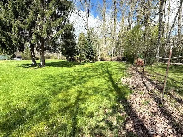 The property ends at the back tree line  Note the fence on the east side of the property.