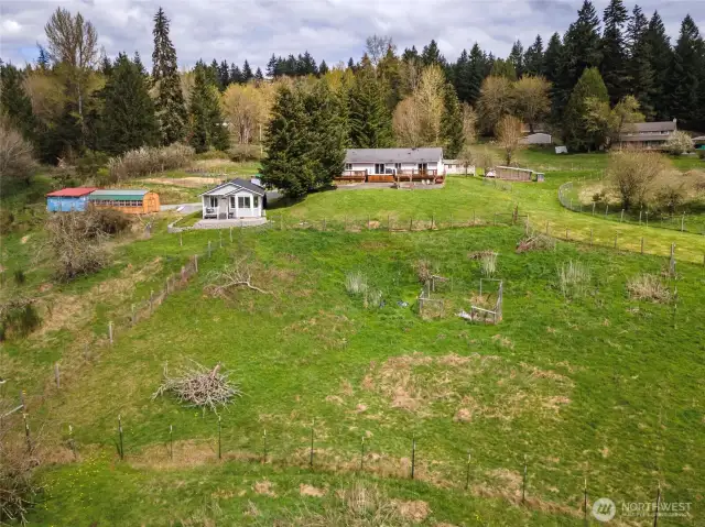 Large shed with green roof does not convey.