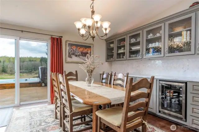 Dining room with bar, storage and beverage refrigerator.
