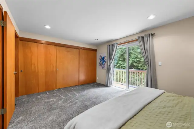 Sliding glass doors to private deck with lovely natural light coming in