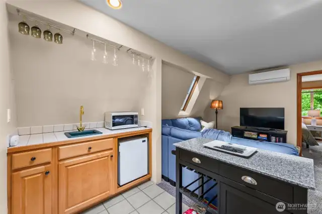 Wet bar with fridge for making drinks.