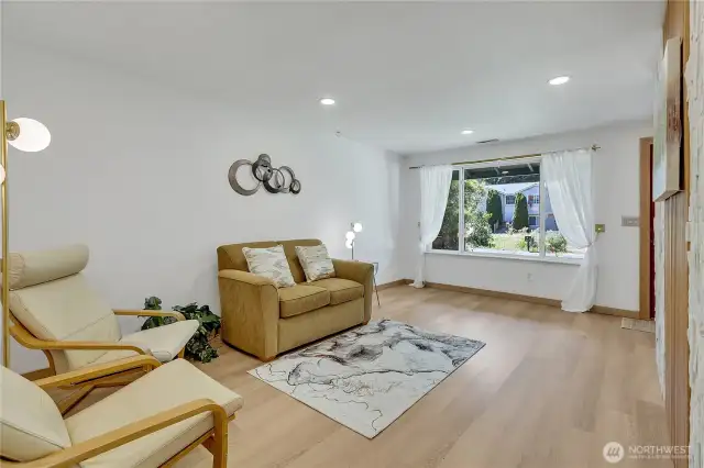 Great sized living room with blonde finished hardwood floors...