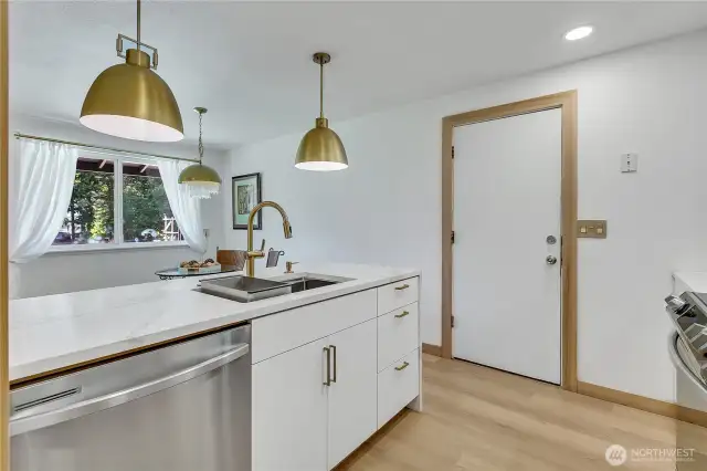 Pental Vivalaro quartz countertops and undermount gourmet kitchen sink and Kohler faucet grace the kitchen...
