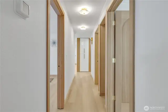 Kenmore luxury vinyl plank flooring leads to the bedrooms and bath.