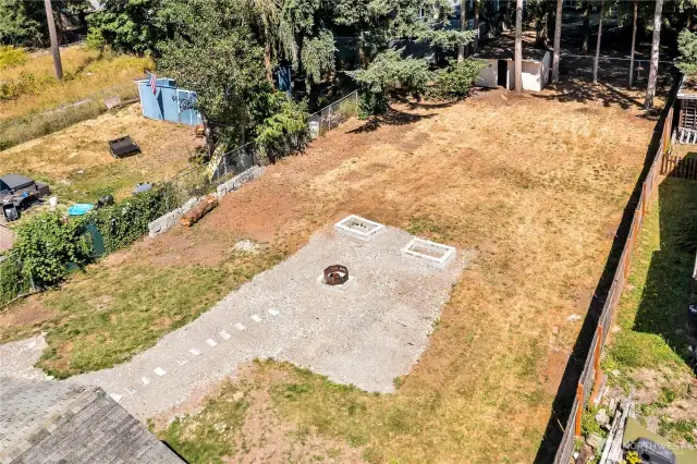 Real yard is long and flat... with a storage shed!