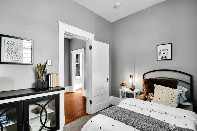 2nd bedroom with closet and high ceilings.