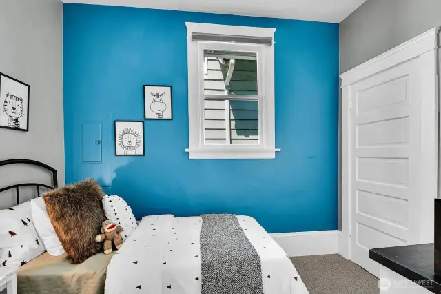 2nd bedroom with closet and high ceilings.
