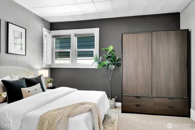 Large primary bedroom with an entrance to the bathroom.
